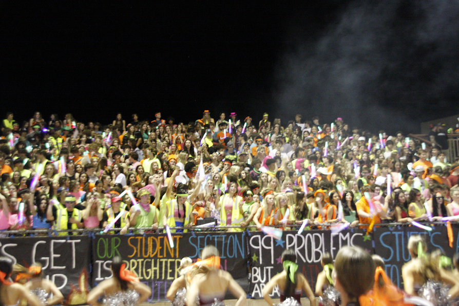 OUR STUDENT SECTION IS BRIGHTER THAN YOUR FUTURE: Desert Mountain Wolves glow with a packed student section for the 2022 Homecoming game against Arcadia. The varsity football team finished strong with a final score of 41-3. “This game was amazing. The players were dominating on the field and played an amazing game. The student section was hype the whole time. This game alone shows why we’re the best football team and student section duo,” says Wolfden President Ryan Libby (12). It was a big highlight of the football season and for school spirit. Students then celebrated the win all Homecoming weekend.
