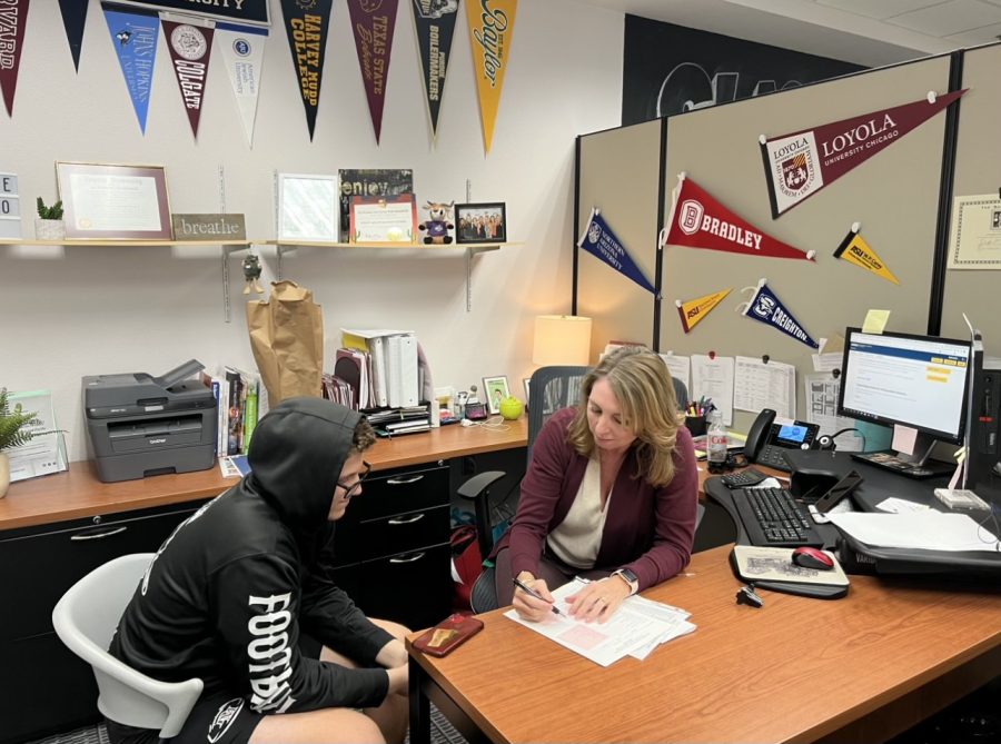 Finding your way.- Mrs. Dorsh is showing student Jackson Ponesse (10) his college options. “I love showing kids there options and helping them think of paths they never considered,” said Mrs. Dorsh. Students struggle with the college process so it is vital that we have someone like Mrs. Dorsh to help out today’s youth.