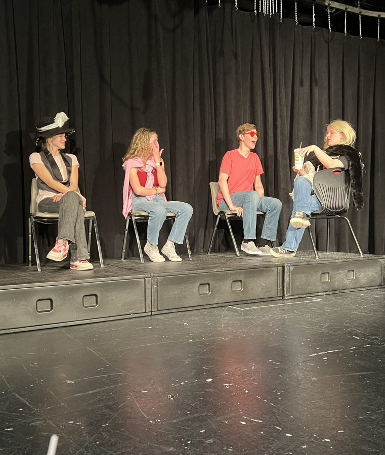 LOVE IS IN THE AIR: (Left to right) Sara Kate Barnes (11), Madeleine Yearout (12), Morgan Taylor (12), and Sophie Perlstein (12) play the Dating Game at the most recent improv show, Love Island. Most of the audience was chuckling, and if they werent, I hope they were at least amused says Perlstein, This is the best team I have been on in the three years I have been doing improv. Im so proud of my team, and shout out to my co-captain, Madeleine! The final improv show of the year will be on March 31st, so come out and support your DMHS thespians!