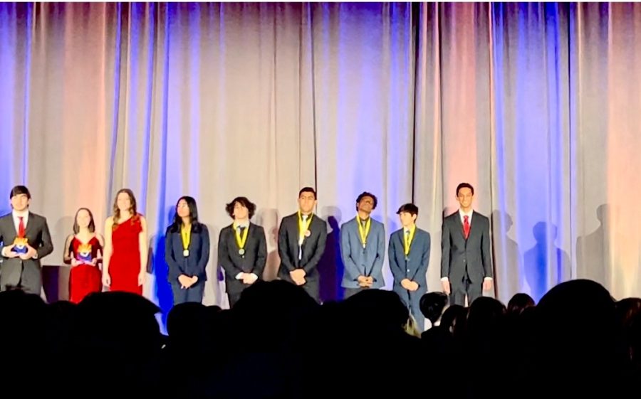 DECA DAYS: Freshman Josh Roga (center) represents DM by earning third place at the Distributive Education Clubs of America (DECA) State Career Development Conference Feb. 23-25 at the Arizona Grand Resort and Spa. Competing in the Principles of Hospitality at DECA was an amazing learning experience in order to gain experience in the real world. said Roga, who competed in the Principles of Hospitality and Tourism competition. I met plenty of people and made tons of friends, so overall, it was a great trip. DM joined students from across the state, who competed in various marketing, finance and business administration events in hope of qualifying for the International Career and Development Conference. Two thirds of the Desert Mountain students moved on to finals and 17 students qualified for Internationals. Next stop, Orlando, Florida in April for all of the students who qualified. 